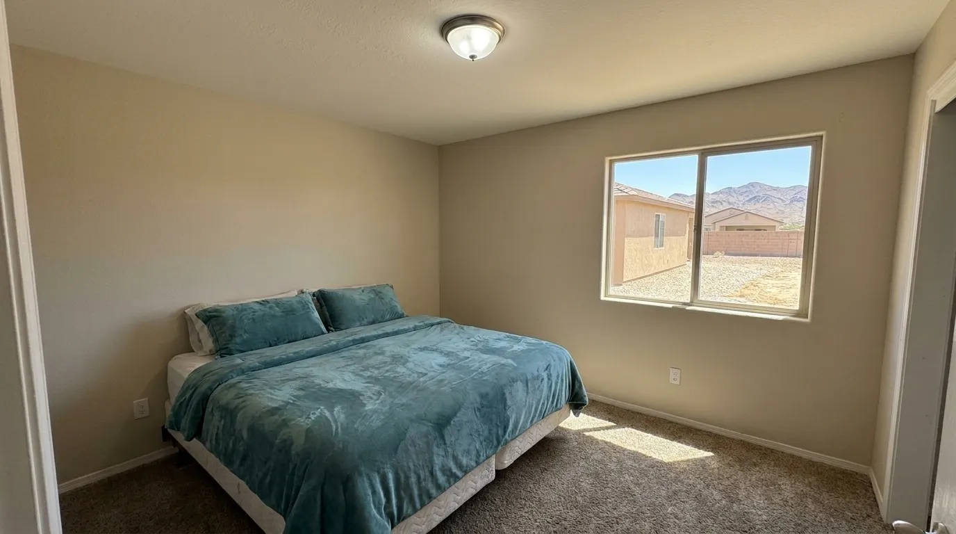 Same bedroom with rebuilt ceiling after storm damage restoration